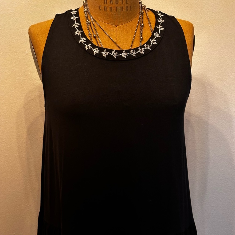 Black swing dress with white embroidery